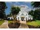Community clubhouse featuring a clock tower, well-maintained landscaping, and a welcoming entrance at 1431 Beckett Dr, Hampton, GA 30228