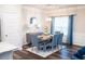 Dining room with stylish lighting, seating for four, and a view to the kitchen at 1431 Beckett Dr, Hampton, GA 30228
