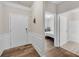 Inviting entryway with wood floors, white trim, and a view into the bedroom and bathroom at 1431 Beckett Dr, Hampton, GA 30228
