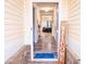 Inviting foyer featuring wood floors, neutral walls, and a glimpse of the living area at 1431 Beckett Dr, Hampton, GA 30228
