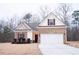 Charming single-story home with a brick and siding exterior and well-manicured landscaping at 1431 Beckett Dr, Hampton, GA 30228