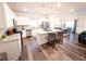 Open-concept kitchen and dining area with modern finishes and stainless steel appliances at 1431 Beckett Dr, Hampton, GA 30228