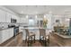 Bright and modern kitchen with stainless steel appliances and granite countertops, open to the dining area at 1431 Beckett Dr, Hampton, GA 30228