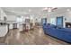 Open-concept living area with dark floors, a modern kitchen, and a cozy fireplace at 1431 Beckett Dr, Hampton, GA 30228