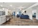 Open concept living space with hardwood flooring and a view to the kitchen and bedroom at 1431 Beckett Dr, Hampton, GA 30228