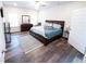 Spacious primary bedroom with wood floors, neutral tones, and plenty of natural light at 1431 Beckett Dr, Hampton, GA 30228