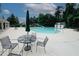 Community pool area featuring a large pool, seating, and mature trees for a resort-like experience at 1431 Beckett Dr, Hampton, GA 30228