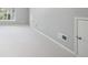Spacious basement with natural light, neutral walls and carpet, and white trim at 255 Kendemere Pointe, Roswell, GA 30075