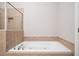 Bathroom with a luxurious, white bathtub at 255 Kendemere Pointe, Roswell, GA 30075