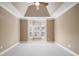 Bedroom with neutral walls, carpet, and a bay window with shuttered blinds at 255 Kendemere Pointe, Roswell, GA 30075