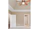 Bedroom with a ceiling fan and two doorways at 255 Kendemere Pointe, Roswell, GA 30075