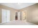 Bedroom with tan walls and access to the ensuite bathroom and walk-in closet at 255 Kendemere Pointe, Roswell, GA 30075