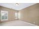 Bedroom with neutral walls, carpet, two shuttered windows, and ample natural light at 255 Kendemere Pointe, Roswell, GA 30075