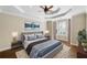 Serene bedroom with tray ceilings, a bay window, hardwood floors and neutral decor at 255 Kendemere Pointe, Roswell, GA 30075