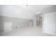 Spacious bonus room with neutral carpet, white doors, and ample lighting at 255 Kendemere Pointe, Roswell, GA 30075