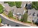 Beautiful elevation showcasing brick and stone design with well-manicured landscaping at 255 Kendemere Pointe, Roswell, GA 30075