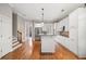Well-lit kitchen with white cabinets, stainless steel appliances, and a center island at 255 Kendemere Pointe, Roswell, GA 30075