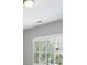 Close up of a window with white shutters and a view of the outdoors at 255 Kendemere Pointe, Roswell, GA 30075