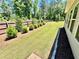 Manicured backyard featuring a lush lawn, wooden fence, and landscaping at 3165 Blackshear Dr, Marietta, GA 30060