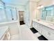 Bright bathroom with double vanity, glass shower, and walk-in closet at 3165 Blackshear Dr, Marietta, GA 30060