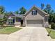 Beautiful home with a two-car garage, brick accents, manicured lawn, and well-maintained landscaping at 3165 Blackshear Dr, Marietta, GA 30060