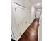 Hallway with hardwood floors, closet and views of the white doors to other rooms at 3165 Blackshear Dr, Marietta, GA 30060
