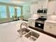 Bright kitchen features a large island with sink and stainless-steel appliances at 3165 Blackshear Dr, Marietta, GA 30060