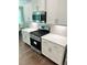 White kitchen with stainless steel gas range, microwave, and white countertop at 3165 Blackshear Dr, Marietta, GA 30060