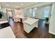 Modern kitchen with white cabinets, stainless steel appliances, and an island overlooking the living area at 3165 Blackshear Dr, Marietta, GA 30060