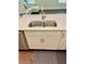 Kitchen island featuring a double sink and modern faucet with white cabinets at 3165 Blackshear Dr, Marietta, GA 30060