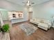 Open-concept living room with hardwood floors, a modern sofa, and a view of the kitchen at 3165 Blackshear Dr, Marietta, GA 30060