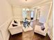 Elegant living room with dark wood floors, wainscoting, and modern chandelier at 3165 Blackshear Dr, Marietta, GA 30060