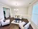 Cozy living room with dark wood floors, white wainscoting, and bright window at 3165 Blackshear Dr, Marietta, GA 30060