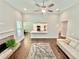 Bright and airy living room with hardwood floors, fireplace, and seamless flow into the kitchen and dining area at 3165 Blackshear Dr, Marietta, GA 30060