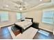 Main bedroom with tray ceiling, ceiling fan and large window at 3165 Blackshear Dr, Marietta, GA 30060