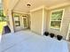 Covered patio with neutral siding, bright white trim, and concrete floor at 3165 Blackshear Dr, Marietta, GA 30060