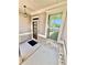 Inviting porch with brick accents, a stylish light fixture, and a view of the landscaped yard at 3165 Blackshear Dr, Marietta, GA 30060
