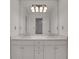 Bathroom features a double vanity, marble countertops, and decorative lighting at 2255 Lenox Ridge Ne Ct, Atlanta, GA 30319