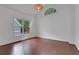 Bright bedroom features hardwood floors, natural light, and a charming light fixture at 2255 Lenox Ridge Ne Ct, Atlanta, GA 30319