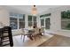 Open dining space featuring a modern light fixture and access to the backyard at 2255 Lenox Ridge Ne Ct, Atlanta, GA 30319