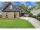Beautiful craftsman-style home with stone accents, manicured lawn and mature landscaping at 2255 Lenox Ridge Ne Ct, Atlanta, GA 30319