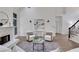 Comfortable living room featuring a fireplace, and modern lighting at 2255 Lenox Ridge Ne Ct, Atlanta, GA 30319
