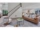 Spacious living room with high ceilings, open staircase, and hardwood floors at 2255 Lenox Ridge Ne Ct, Atlanta, GA 30319