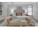 Relaxing main bedroom featuring a bed bench, soft lighting, and stylish décor at 2255 Lenox Ridge Ne Ct, Atlanta, GA 30319