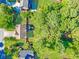 Aerial view of the property showing landscaping and tree coverage at 435 Flowering Trl, Grayson, GA 30017