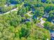 An aerial view highlighting home in a wooded community at 435 Flowering Trl, Grayson, GA 30017