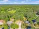 An aerial view showcasing the home's placement among lush trees at 435 Flowering Trl, Grayson, GA 30017