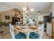 Cozy dining area features a table with blue cushions, a chandelier and access to living room at 435 Flowering Trl, Grayson, GA 30017