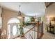 Inviting foyer with hardwood floors leading to carpeted stairs and an open dining area at 435 Flowering Trl, Grayson, GA 30017