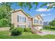 Beautiful home with manicured lawn, large windows, and a welcoming front porch at 435 Flowering Trl, Grayson, GA 30017